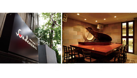 “オペラ歌手の生演奏が聴ける”日本初のワインバー「wine & music CADENZARE（カデンツァーレ）&reg;」（東京都港区西麻布1-4-41　麻布ファーストビルB1F）。シックで重厚な存在感を放つグランドピアノがオーセンティックな店内をムーディに演出している。