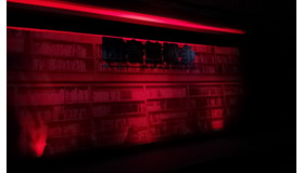 会見の看板。図書館が燃えてます。