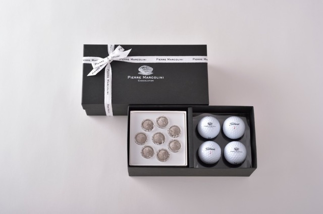 ピエール・マルコリーニが贈る2015年父の日ギフトは、人気の「トリュフ シャンパーニュ」と、マルコリーニのロゴ入りゴルフボールをアソートしたブラックのシックな装いの限定ギフトボックス。6月10日（水）～100セットの限定数量まで販売。